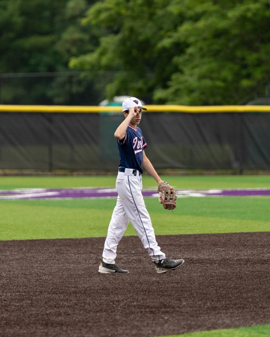 Baseball fielder walking the infield